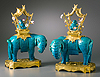 A very fine pair of Louis XV gilt bronze mounted Ming Dynasty turquoise porcelain elephants with Qing Dynasty turquoise porcelain Buddhas ornamented with Louis XV porcelain flowers attributed to Vincennes